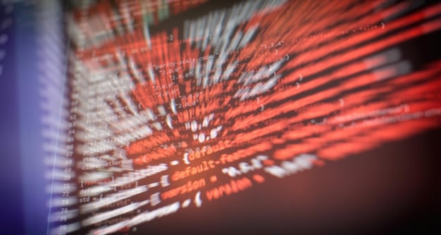 A close-up of a computer screen showing lines of code and AI algorithms at work, symbolizing the advanced technology that powers predictive analytics.